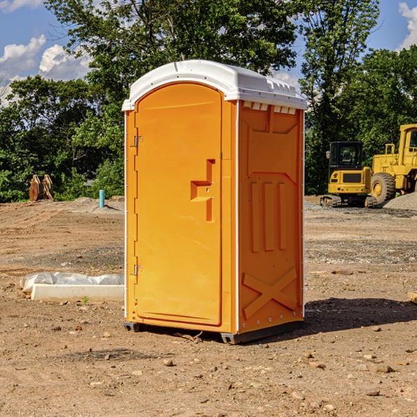 what is the cost difference between standard and deluxe portable restroom rentals in Sholes